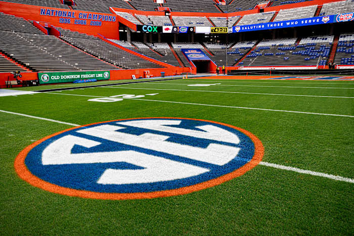 The SEC logo in orange and blue colors is painted on the field before the game between the Florida Gators and Arkansas Razorbacks at Steve Spurrier Field at Ben Hill Griffin Stadium in Gainesville, FL on Saturday, November 4, 2023. [Matt Pendleton/Gainesville Sun]